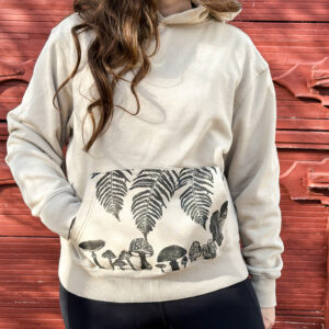 Size M - Sand-colored woodland pocket hoodie with fern and fungi explosion