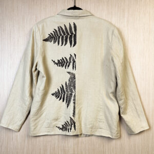 Back of jacket with brown ferns printed growing out of back seam.