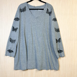 Front of grey v-neck t-shirt with three quarter sleeves printed with moths and butterflies in black ink.