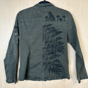 Back of jacket with cedar, toad, and mushroom print.
