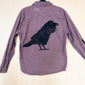 Raven print on back of shirt.