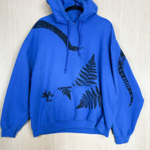 Front of blue hoodie with snake print on back of folded left sleeve, black snake printed head coming down from right shoulder, toad jumping out of front pocket, and ferns printed growing out of and over pocket.