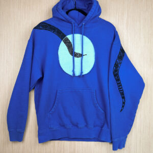 Front of bright blue hoodie with large light blue circle across front chest, black snake coming down from right shoulder, tail print shown on back side of folded over left sleeve.
